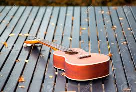 A diverse collection of ukulele tabs featuring unique arrangements you won't find anywhere else. Ukulele Guitar On Wood Table In The Garden Under The Morning Sunlight Stock Photo Picture And Royalty Free Image Image 60077488