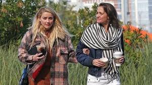 She stands 5 feet 7 inches or 1.7 m (170 cm) tall and weighs only 132 pounds or 60 kg. Amber Heard And Bianca Butti Are Off On A Valentine S Day Trip