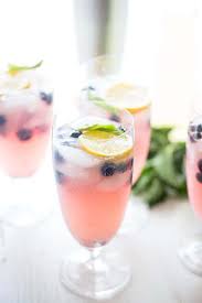 I love pitcher cocktails for summer dinner parties! Blueberry Vodka Lemonade Lemonsforlulu Com