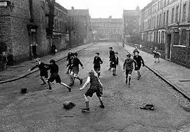 Black And White Children Playing Together The 19 Rules Of Playing Football When You Re A Kid Playing Football Kids Playing Photography Street Football