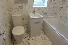 I have carrara marble hexagon tile floor in my bathroom with white 3x6 subway tiled walls. Coventry Bathrooms Italian Carrara Marble Effect Wall And Floor Tiles