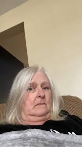 what hairstyle would suit a 60-year-old woman with thin, grayish-blonde  hair?