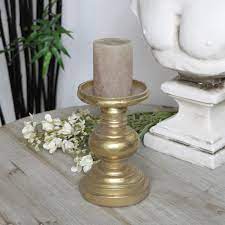 Pair of pale green resin graduated size pillar candle holders. Antique Gold Candle Stand