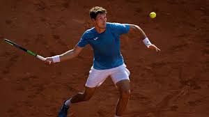 Each player uses a tennis racket that is strung with cord to strike a hollow rubber ball covered with felt over or around a net and into the opponent's court. Pablo Carreno Busta Reaches Final In Hamburg Atp Tour Tennis