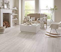 Light Decor Helps To Keep A Space Feeling Bright House Flooring White Hardwood Floors Living Room Flooring