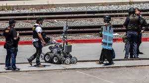 Two people hug on younger avenue outside the valley transportation authority light rail yard after a mass shooting occured in san jose, california on may 26, 2021. 1issfdldmpbtbm