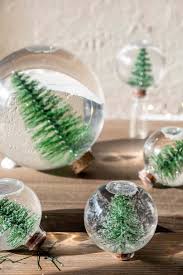 See the photos on how to decorate a window with drawings, balls, pine cones and shining lights. Make An Easy Diy Snow Globe The Art Of Doing Stuff