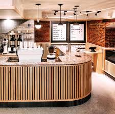 Patent Pending Nyc Is A Coffee Shop By Day And Hidden Speakeasy By Night After The Doors To The Bright And Ligh Nyc Coffee Shop Cafe Interior Home Bar Designs