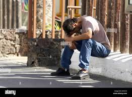 Sitting Hunched High Resolution Stock Photography And Images Alamy