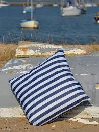 The cushion's bold stripe print in charcoal is reminiscent of a relaxing poolside retreat. Navigate Coast Outdoor Cushion With Navy Stripe Very Co Uk