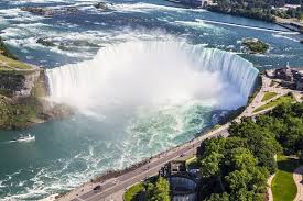 Niagara falls is a group of three waterfalls at the southern end of niagara gorge, spanning the border between the province of ontario in ca. How To Plan A Trip To Niagara Falls Canada Waterfalls Toronto Evbeing