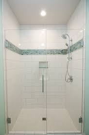 White Tiled Shower With Aqua Mosaic Accent Strip And Glass Shower Door Shower Accent Tile White Tile Shower Accent Tile Bathroom