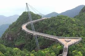 This magnificent curved bridge finished construction in 2005 and essentially the ticket booths are in the village so you must get down there call beforehand in case the weather is bad or there is a lot of traffic. Langkawi Tour With Skybridgewalk Langkawi Cable Car Oriental Village Pass Compare Prices 2021