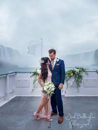 The Most Stunning Wedding Photograph Ever Bride And Groom Under Niagara Falls The Most Iconic Weddi Fall Wedding Photos Niagara Falls Wedding Niagara Wedding