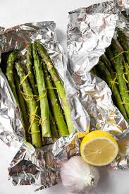 Toss lightly in the butter that has melted at the bottom of the tray, and serve immediately. Lemon Garlic Grilled Asparagus In Foil Spoonful Of Flavor