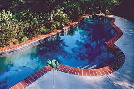 The same forming system, with a bullnose travertine form liner was used for this vinyl pool. Marion Ceramics Pool Coping