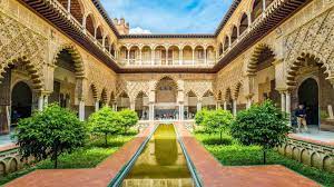 The real alcázar in seville is a group of palaces surrounded by a wall. Alcazar Of Seville Tour In English Skip The Line Tickets Included