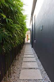 Side yard becomes a practical road without you having to bother to walk into the house just to go to the front yard to the backyard, so the use of the trail is also very important here. Stone Pathway The Nice Landscaping Stone Pins For You To Build Your Garden Backyard Gabion Wall Gabion Fe Side Yard Landscaping Modern Landscaping Backyard