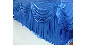 Here at premier table linens, we manufacture the most requested custom height skirting for stages, risers, bars, counters, demo tables, stands and dj booths. Amazon Com Ice Silk Banquet Table Skirt With Swag Ruffled Table Skirting For Weddings Or For Christmas Party 7 Meters Royal Blue Kitchen Dining
