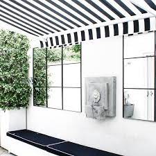 For A Minute I Considered Doing Navy And White Striped Awnings On Our New House Then I Found This Old Photo Of My Clients Court Outdoor Living House New Homes