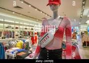 SINGAPORE - CIRCA APRIL, 2019: clothes on display at Guess the ...