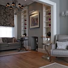 Design ideas for a medium sized victorian enclosed living room in london with grey walls, light hardwood flooring, a wood burning stove, a tiled fireplace surround, a wall mounted tv and brown floors. Victorian Terraced Townhouse In Primrose Hill North West London Traditional Living Room London By Tag Architects Houzz