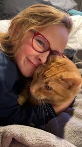 Litter mates Simba (the orange) and Harley (the black) disagreeing lol.  It's so funny to watch them slap each other with their big ol' paws! They  are both rescues who had to