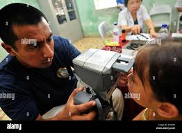 U.S. Navy Medical Corpsman 1st Class Daniel Doe, pharmacy outpatient  instructor, checks over medication orders during a class at the Medical  Education and Training Center (METC), Joint Base San Antonio-Fort Sam  Houston,
