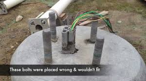 how to fix misplaced pole base bolts for parking lot pole lights