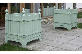 The decorative balls are made of cast iron. Two Versailles Painted Wood And Metal Planter Boxes By Les Jardins Du Roi Soleil With Detachab