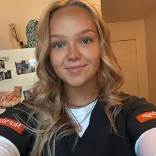 Two dogs running at Wyoming public school by the tennis courts