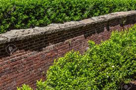 Check spelling or type a new query. Tall Red Brick Retaining Wall With Rough Stone Cap Shrubbery Stock Photo Picture And Royalty Free Image Image 121786231