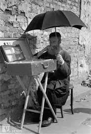 A Jewish Vendor Sitting On The Street In The Warsaw Ghetto Shades Himself With A Large Umbrella Warsaw Ghetto Warsaw Warsaw Ghetto Uprising