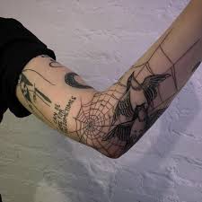 People who love realistic tattoos will love this design. Birds And Spider Web Tattoo Idea