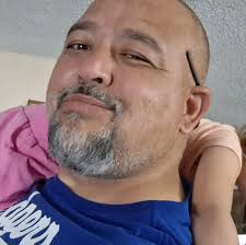 What is the name of the late 80s movie where aliens live among humans and  are protected by a radio transmission?