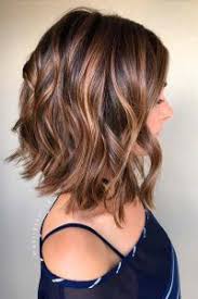 With blonde color layered overtop of a medium brunette shade, this curly bob looks endlessly dimensional and full of bounce. 37 Cute Curly Hairstyles For Women