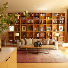 I love the idea of creating a nook around your bed as if it were inset, and tall bookshelves flanking the bed do the trick beautifully. Built In Bookcase Midcentury Houzz