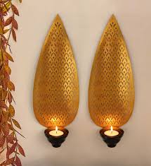 You can use screws and a cordless drill! Tied Ribbons Set Of 2 Wall Hanging Tealight Candle Holder Metal Wall Sconce With Tealight Candles For Christmas Lighting Home Decoration Set Of 2 Buy Online In Brunei At Brunei Desertcart Com Productid 76848245