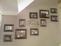 Photo Wall Updated The Layout Of The Photo Wall Up Our Staircase By Adding More Frames And A Decal Fina Ikea Gallery Wall Gallery Wall Frames Frames On Wall