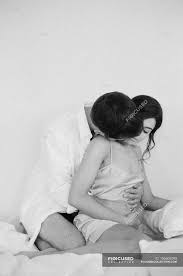 Silhouette of man and woman kissing, kiss couple love intimate relationship passion, cartoon couple silhouettes creative, cartoon character, heart, couple png. Man Kissing Woman While Hugging Two Female Stock Photo 156600290