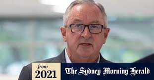 NSW COVID: 6062 new cases and one death, as Brad Hazzard calls for review  of travel tests