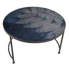 Placed at the centre of the living room, a coffee table links all of the elements in a room. Iron Coffee Table With Blue Fern Glass Top