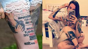 Eminem also has 'd' on his right forearm and '12' on his left. Scottish Stan Shows Eminem Tattoos That Earned Her Guinness Record Eminem Pro The Biggest And Most Trusted Source Of Eminem