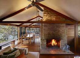 Large window spaces were made throughout each room so that natural light could help the space seem open and large. Treetops Home In Australia Is The Perfect Combination Of Rustic And Modern Design Photos Huffpost Life