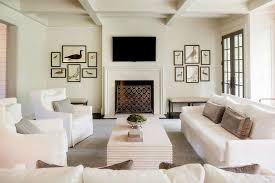 When we have the option i always place the tv to one side of the fireplace, says designer scot meacham wood. White Living Room With Tv Over Fireplace Transitional Living Room