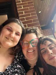 Can anyone remove the person in the middle and move the others closer  together please