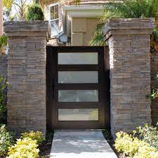 It is separated with a pair of hinges, which allow it to move in and out. 34 Marvelous Modern Garden Doors You Need To Check Out In 2021 House Gate Design Gate Designs Modern House Fence Design