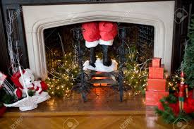 When do christmas decorations come down. Santa S Pants And Boots Coming Down The Chimney With Christmas Decorations Around Stock Photo Picture And Royalty Free Image Image 5373730
