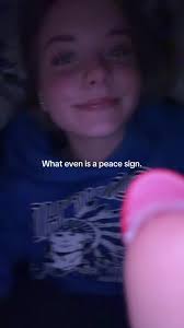 Peace Sign under Chin Meaning