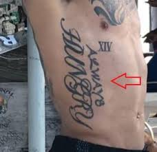 There is a gigantic depiction of his father and him with the words a rather huge tattoos of deadshot and bullseye cover his right upper arm. Danny Green S 12 Tattoos Their Meanings Body Art Guru